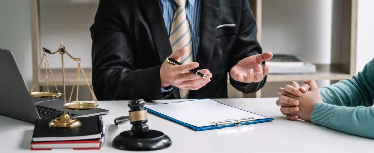 Workers' compensation attorney speaking with client