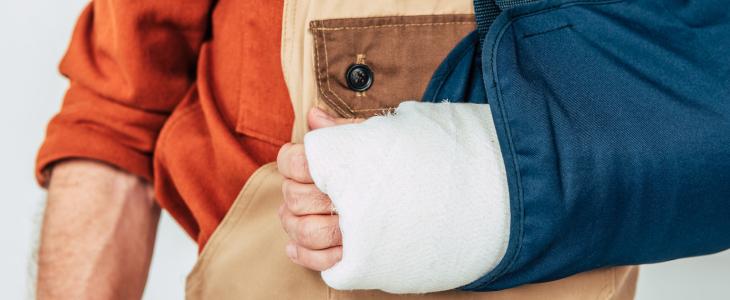 Injured worker with arm in a case and sling