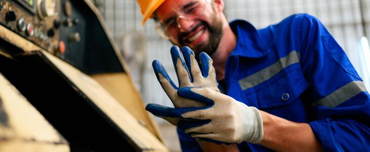 Worker with hand caught between machinery