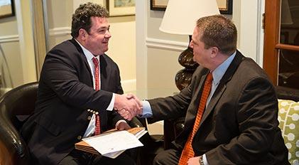 Atlanta and Savannah attorney shaking hands with a client