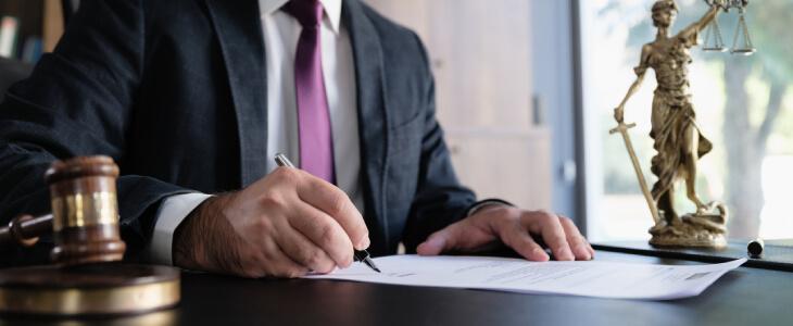 Attorney filling out paperwork.