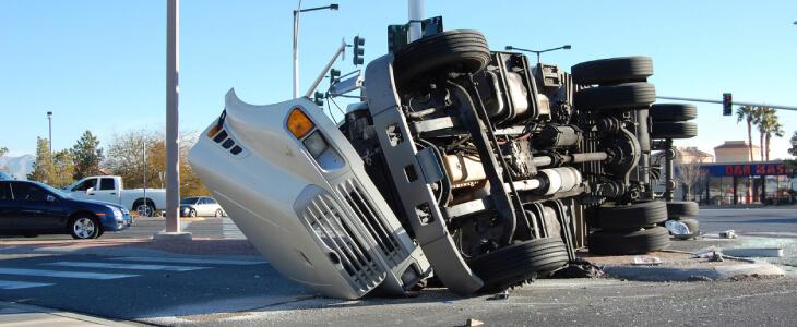 Truck crashed on highway median.